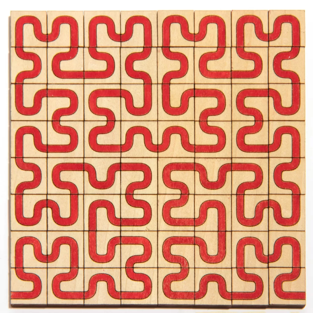 The Hilbert curve can also be defined by a set of tiles. The tiles were cut out and colored by hand afterwards. (Photo: Edmund Harriss)